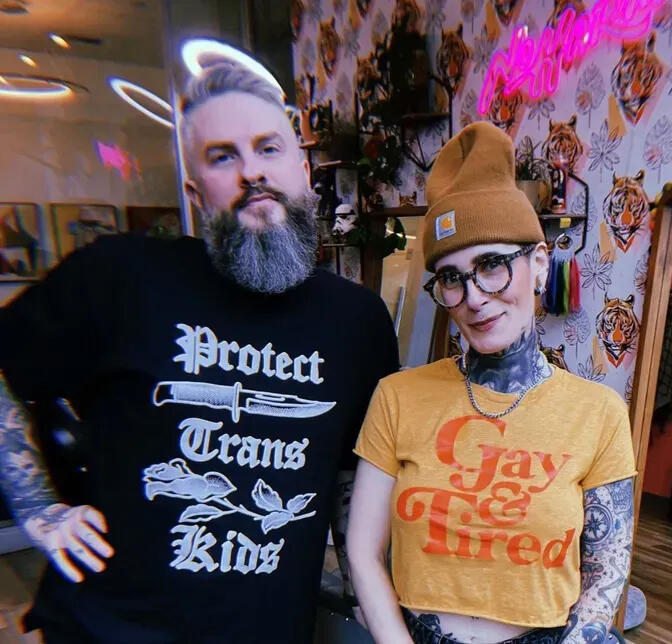 Read my conversation with the owners of No Harm LGBTQ affirming hairstylist couple in Seattle wearing fun queer shirts