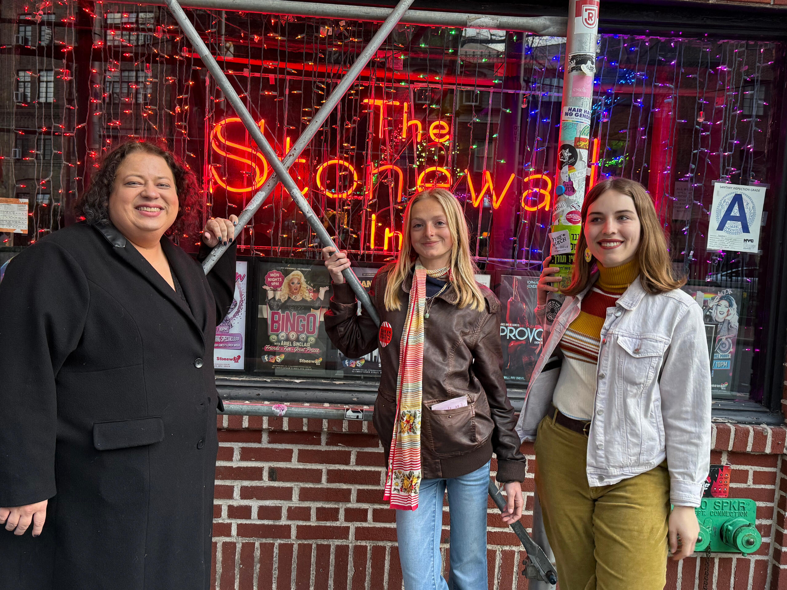 LGBT journalists pose for photo outside Stonewall in New York City